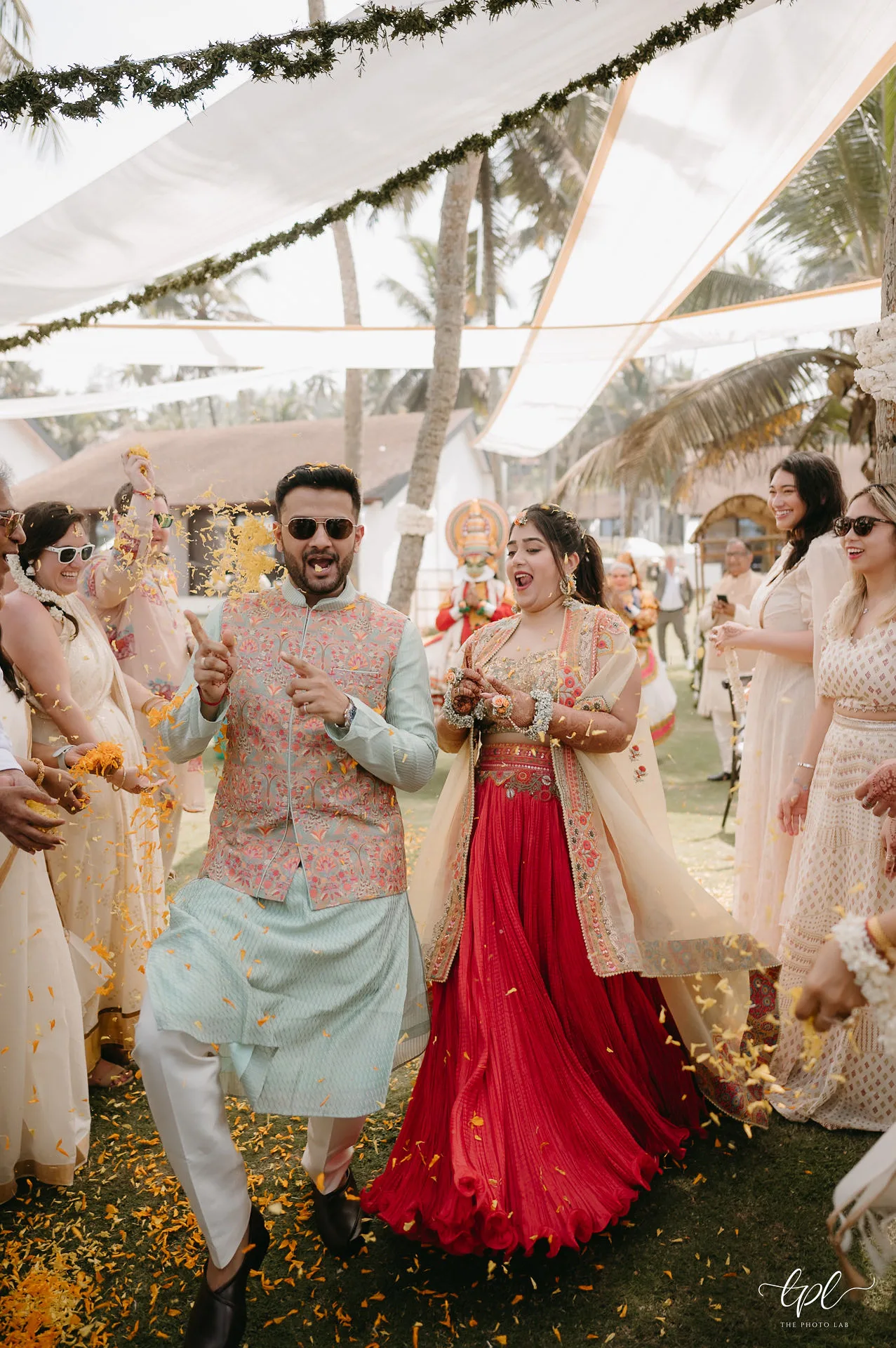 Outdoor wedding installation with flowers and traditional details